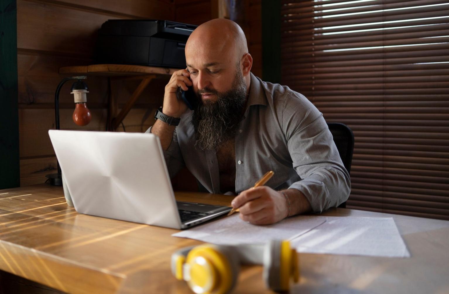 Person reviewing financial documents with flexible planning tools